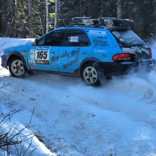 Tractor flap exhaust and snowboards on the roof. Rally is SRS BSNS